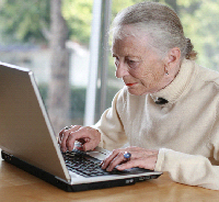 An older person using a computer